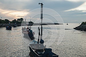 Western sunset shining on easterly clouds at Cha-um beach