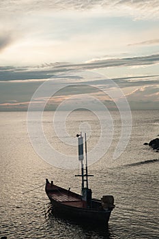 Western sunset shining on easterly clouds at Cha-um beach