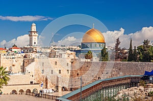 Western Wall with the iconic Dome of the Rock above photo