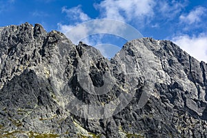 The western wall of Lomnica Peak Lomnicky stit, Lomnicky Peak with the classics of climbing routes, illuminated by the afternoon