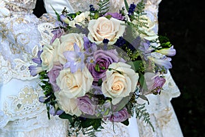 Western wedding dress and purple wedding bouquet