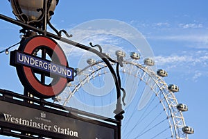 Westminster sign and the London eye blue sky