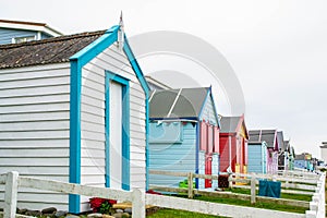 WESTWARD HO!, DEVON, ENGLAND - 21 June 2021: Beach huts in Westward Ho! in Devon, England