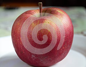 Wet apple red color on the table