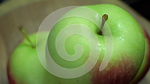 Wet apples rotate, close-up video. Ripe fruit.