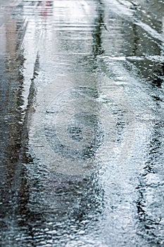 Wet asphalt road after rain. rainy weather in the city