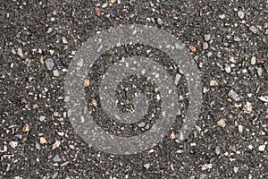 Wet asphalt road texture, dark background. Background of wet and dark gray asphalt