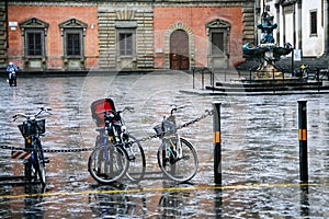 wet bicycles on piazza della santissima annunziata