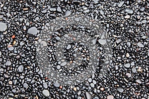 Wet black pebbles Beach Vik, Iceland