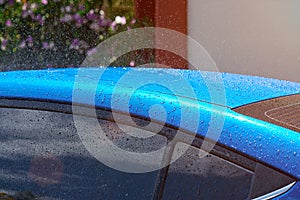 Wet blue car roof