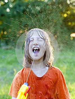 Wet Boy Fooling Around Squirting Water