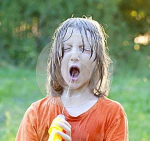 Wet Boy Fooling Around Squirting Water