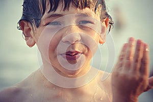 Wet Boy Wiping Water From Face