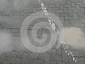 The wet brick paving road