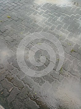 The wet brick paving road