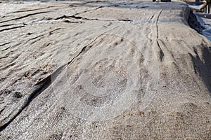 Concrete curing by Wet burlap cover on its surface