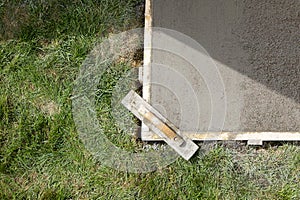 Wet cement slab form work and finishing screed