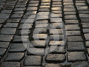 Wet cobblestone street closeup