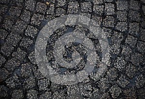 Wet cobblestoned european street background photo