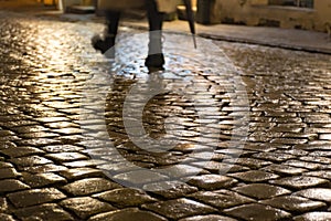 Wet cobblestones at night after rain