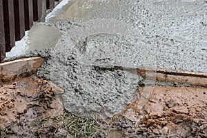 Wet concrete and dirt at construction site