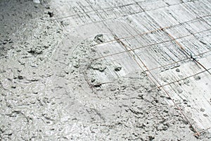 The wet concrete is poured on wire mesh steel