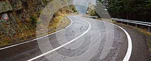 Wet curved alpine road, wide picture. Wet curved alpine road, wide picture. Snaky road