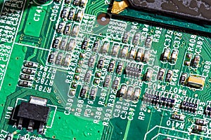 wet digital circuit board with microprocessors and components, closeup full-frame macro background