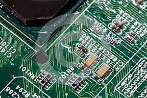 wet digital circuit board with microprocessors and components, closeup full-frame macro background