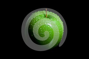 Wet green granny smith apple with black background