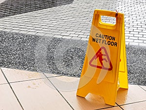wet floor caution sign at the buiding enterance.