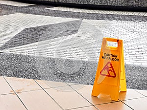 wet floor caution sign at the buiding enterance.