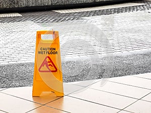 wet floor caution sign at the buiding enterance.