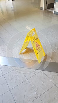 Wet floor sign yellow slippery surface