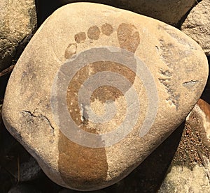 Wet footprint on stone