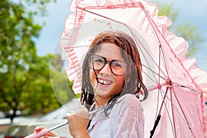 Wet Girl Holding Frilly Umbrella and Wearing Water Spotted Glass