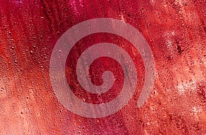 abstract background of red wet glass.