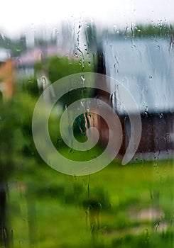 Wet glass of window with raindrops