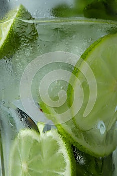 Wet glass of mojito cocktail, close up