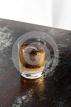 Wet glass with strong whiskey and