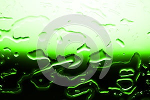 Wet glass surface in drops of water, green gradient, illustration of cood or cold bottle of beer or drink, spilled water texture