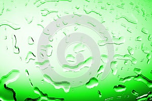 Wet glass surface in drops of water, green gradient, illustration of cood or cold bottle of beer or drink, spilled water texture