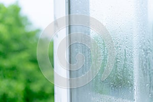 Wet glass window with raindrops