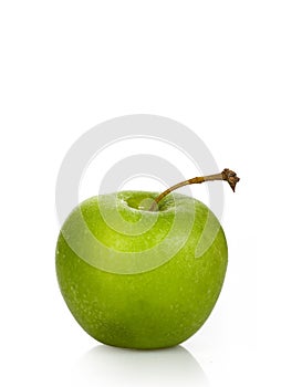 Wet green apple on a white background