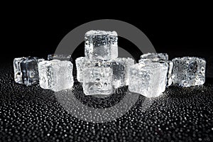 Wet ice cubes on black background