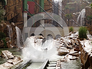 Wet log flume ride in canyon setting family fun