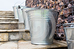 Wet Metal Buckets on stairs