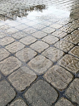 Wet modern pavement background closeup