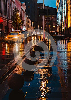 Wet night city street rain Bokeh reflection bright colorful lights puddles sidewalk Car