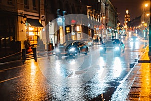 Wet night city street rain Bokeh reflection bright colorful lights puddles sidewalk Car